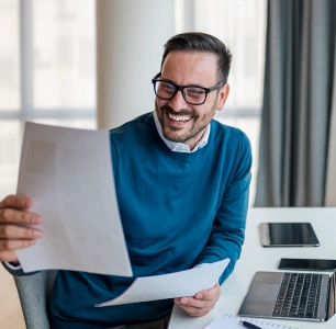 Man looking at invoice